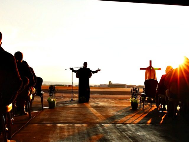 An Army chaplain delivers a sermon to soldiers during an Easter service. A chaplain who wa