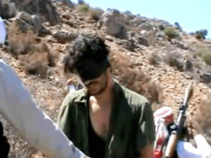 In this image taken from undated video posted to YouTube, American freelance journalist Austin Tice, who had been reporting for American news organizations in Syria until his disappearance in August 2012, prays in Arabic and English while blindfolded in the presence of gunmen. The Associated Press could not independently confirm …