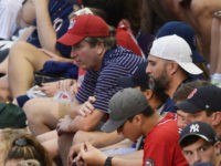 Brett-Kavanaugh-MLB-all-star-game-ap Supreme Court nominee Judge Brett Kavanaugh, in red hat, sits in the stands before the Major League Baseball All-star Game, Tuesday, July 17, 2018 in Washington. (AP Photo/Susan Walsh)