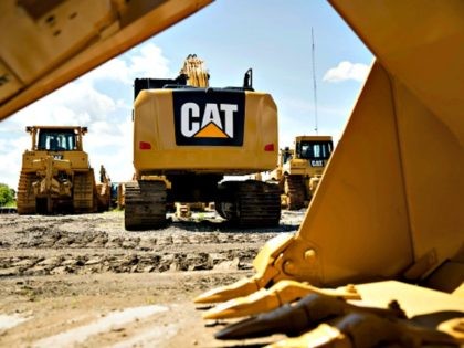 A Caterpillar Inc. excavator sits outside the Altorfer Cat dealership in East Peoria, Illi