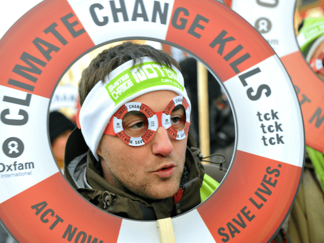 One of some of 30,000 people demonstrates on December 12, 2009 in the center of Copenhagen