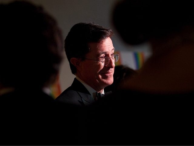 Comedian Stephen Colbert speaks with the media as he arrives at the 35th Kennedy Center Ho