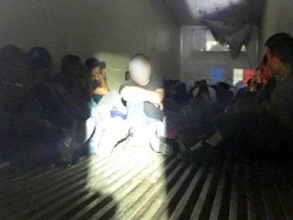 Border Patrol agents find 78 illegal aliens locked in refrigerated tractor-trailer. (Photo