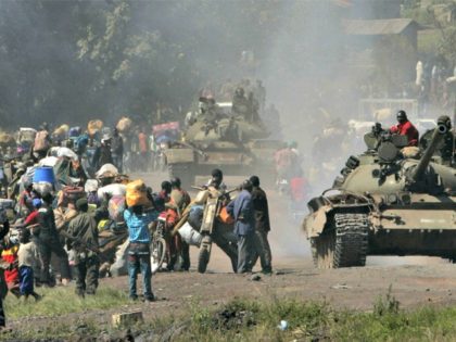 Congolese tanks and thousands of displaced people stream into Goma in eastern Congo, Wednesday, Oct. 29, 2008. Thousands of refugees started streaming into the eastern provincial capital of Goma in the afternoon, impeded by army tanks, trucks and jeeps pulling back from the battle front.