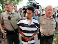 Cristhian-Bahena-Rivera-Mollie-Tibbetts-Aug-22-2018-AP Cristhian Bahena Rivera is escorted into the Poweshiek County Courthouse for his initial court appearance, Wednesday, Aug. 22, 2018, in Montezuma, Iowa. Rivera is charged with first-degree murder in the death of Mollie Tibbetts, who disappeared July 18 from Brooklyn, Iowa. (AP Photo/Charlie Neibergall)