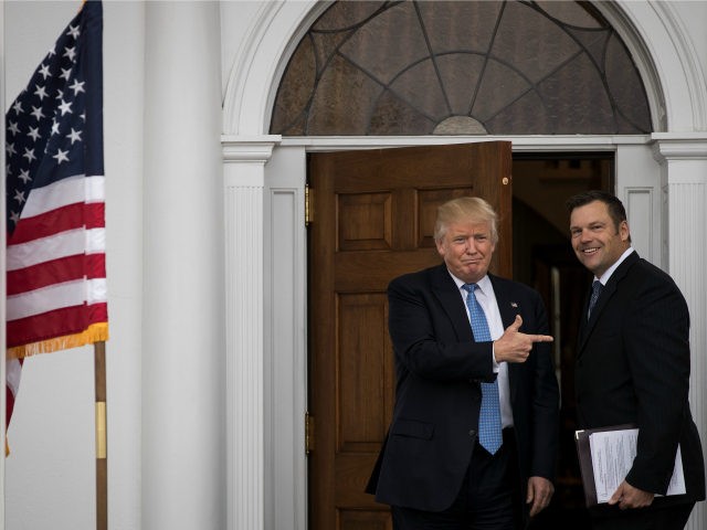 President-elect Donald Trump and Kris Kobach, Kansas secretary of state, pose for a photo
