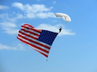 WATKINS GLEN, NY - AUGUST 05: A sky diver displays an American flag prior to the start of the Monster Energy NASCAR Cup Series GoBowling at The Glen at Watkins Glen International on August 5, 2018 in Watkins Glen, New York. (Photo by Robert Laberge/Getty Images)
