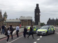BRITAIN-POLICE-INCIDENT A video grab taken from AFP TV video footage shows police officers cordonning off Westminster Bridge, leading to Parliament Square in central London on August 14, 2018, after a car was driven into barriers at the Houses of Parliament. - A "number of pedestrians" were injured when a car crashed …