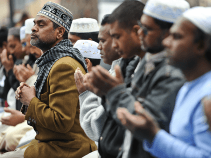 Muslims living in Italy pray in front of the monument dedicated to king Victor Emmanuel II