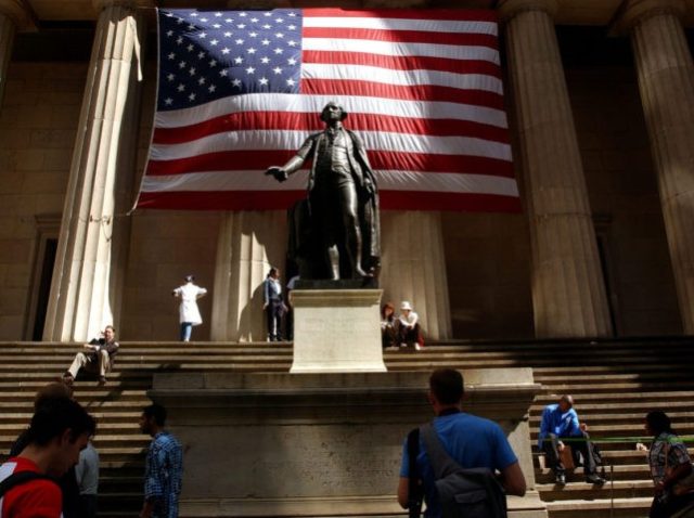 NEW YORK- SEPTEMBER 5: Pedestrians walk around the George Washington statue in front of F