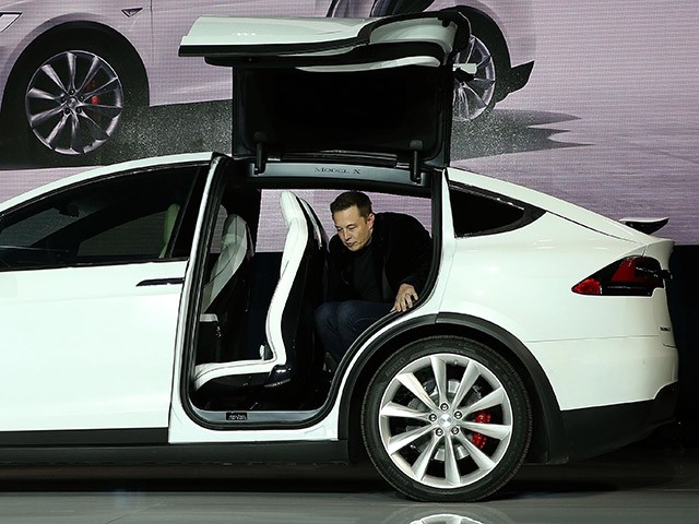 FREMONT, CA - SEPTEMBER 29: Tesla CEO Elon Musk steps out of the new Tesla Model X during an event to launch the company's new crossover SUV on September 29, 2015 in Fremont, California. After several production delays, Elon Musk officially launched the much anticipated Tesla Model X Crossover SUV. The (Photo by Justin Sullivan/Getty Images)