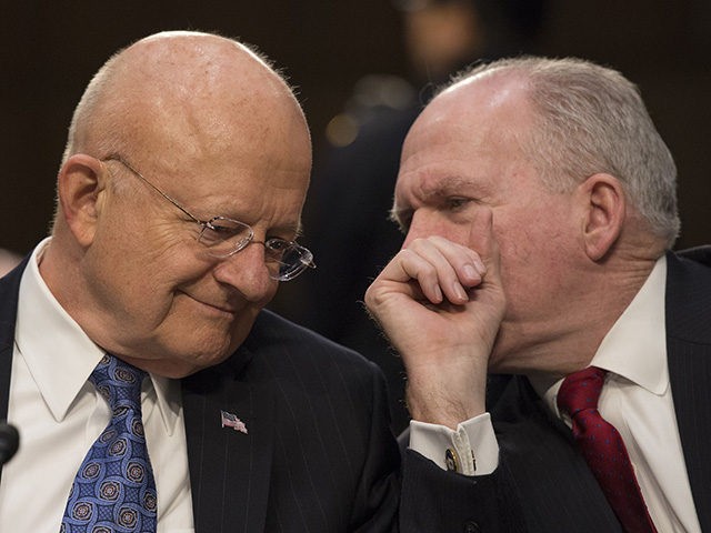 Director of National Intelligence James Clapper(L) and CIA Director John Brennan chat befo