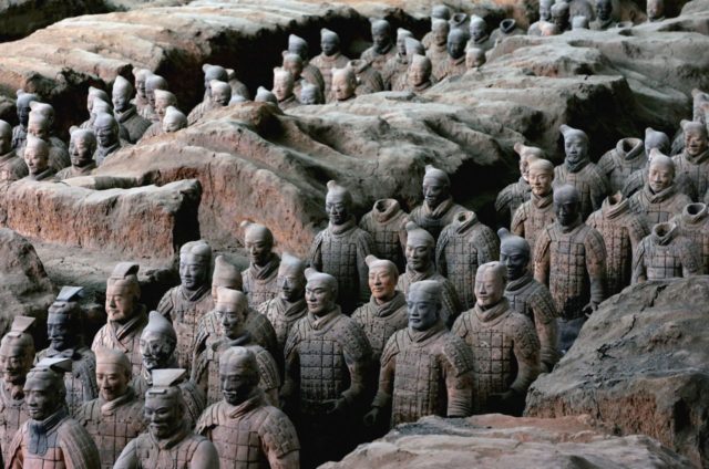 LINTONG COUNTY, CHINA - JULY 7: (CHINA OUT) Ancient terracotta warriors stand in a pit at the Emperor Qin's Terracotta Warriors and Horses Museum on July 7, 2006 in Lintong County of Shaanxi Province, China. The Emperor Qin's Terracotta Warriors and Horses Museum is the largest on-site museum in China …