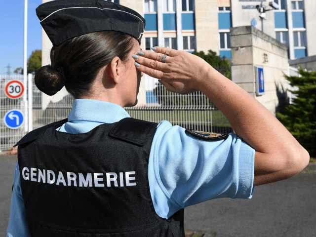A French woman gendarme gestures in front of the new gendarmerie in La Rochelle western Fr