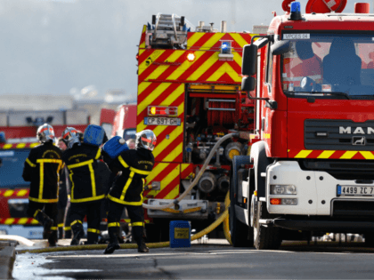 Firefighters work at the site of an explosion at the Saipol factory in Dieppe on February