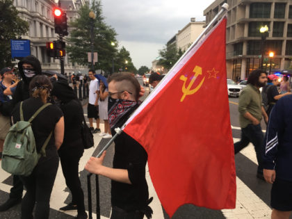 Communist flag displayed at counter-protest to Unite the Right demonstration in DC on the one year anniversary of Charlottesville protests (Credit: Matthew Perdie/Breitbart News)