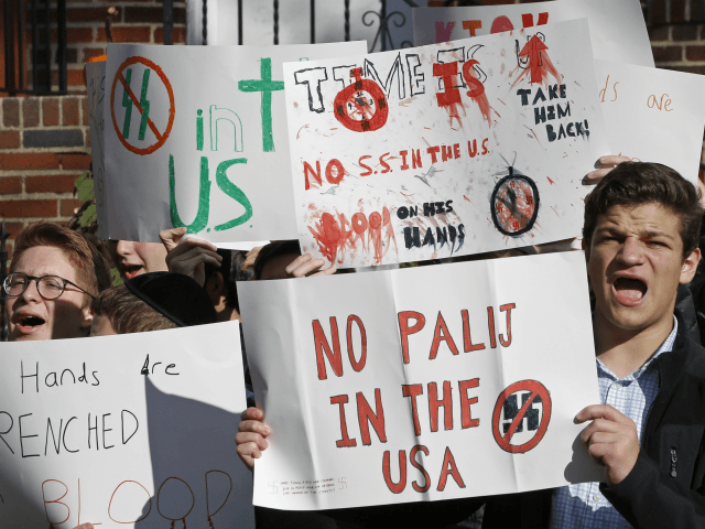 High school students from the Orthodox Jewish Rambam Mesivta school protest across the street from the home of Jakiw Palij, 94. a former Nazi concentration camp guard whose citizenship has been revoked, but hasn't been deported, Thursday, Nov. 9, 2017, in the Jackson Heights neighborhood of New York. Palij was …