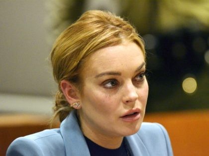 Lindsay Lohan attends her probation hearing with attorney Shawn Chapman Holley (not pictured) at the Airport Courthouse on March 29, 2012 in Los Angeles, California. Judge Stephanie Sautner ended Lohan's formal probation after concluding that she has completed the terms of her sentence for her 2007 DUI conviction and probation …
