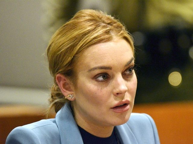 Lindsay Lohan attends her probation hearing with attorney Shawn Chapman Holley (not pictur