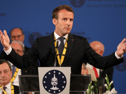 France's President Emmanuel Macron gives a speech after receiving the Charlemagne prize during the award ceremony on May 10, 2018 in Aachen, western Germany. - French President Emmanuel Macron received the prestigious Charlemagne Prize for his 'contagious enthusiasm' for strengthening EU cohesion and integration. (Photo by LUDOVIC MARIN / AFP) …