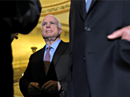 In this June 16, 2015 file photo, Senate Armed Services Committee Chairman John McCain, R-Ariz., listens during a news conference on Capitol Hill in Washington. Over White House objections, the Senate is poised to pass a $612 billion defense policy bill that calls for arming Ukraine forces, prevents another round …