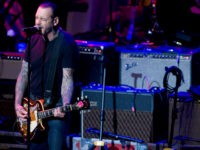 Mike-Ness-Social-distortion-guitar-ap Mike Ness performs at the 6th Annual Little Kids Rock benefit presented by Guitar Center at the Hammerstein Ballroom on Thursday, Oct. 23, 2014 in New York. (Photo by Stephen Chernin/Invision/AP)