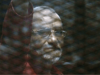 Muslim Brotherhood spiritual leader, Mohammed Badie wearing a red jumpsuit that designates