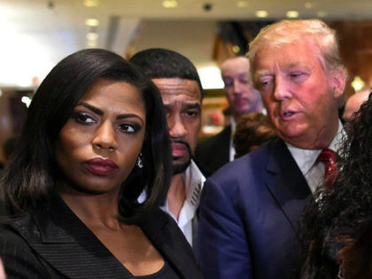 Omarosa Manigault (L) who was a contestant on the first season of Donald Trump's 'The Apprentice' and is now an ordained minister, appears alongside Republican presidential hopeful Donald Trump during a press conference November 30, 2015 that followed Trump's meeting with African-American religious leaders in New York. AFP PHOTO / …