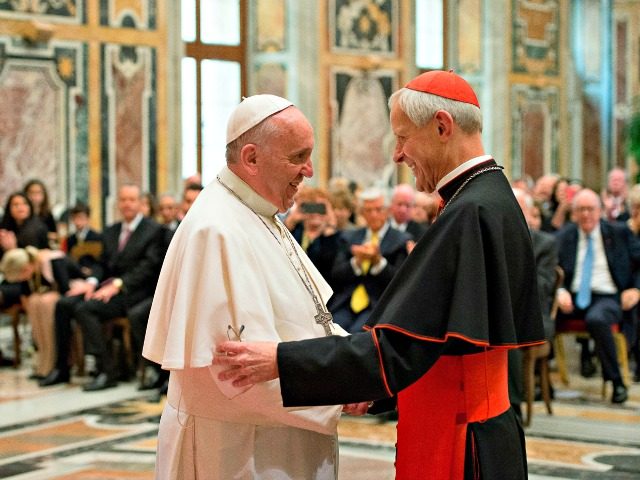 In this April 17, 2015, file photo, Pope Francis, left, talks with Papal Foundation Chairm