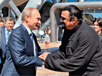 Putin, Steven Seagal Russian President Vladimir Putin, left, and U.S. actor Steven Seagal shake hands after visiting an oceanarium built on Russky Island, where the Eastern Economic Forum takes place, in Russian Far Eastern port of Vladivostok, Russia, Friday, Sept. 4, 2015.