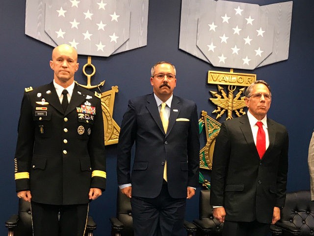 Mr. Tony Dunne and Mr. Tim Nix receive the Secretary of Defense Medal for Valor