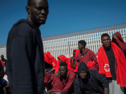 Migrants rescued at sea wait to be transferred at the harbour of Algeciras on July 30, 2018. - Close to 21,000 migrants have arrived in Spain by sea since the beginning of the year and 304 died in the attempt, the International Organization for Migration says. (Photo by JORGE GUERRERO …