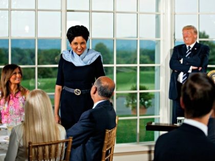 Trump PepsiCo's departing CEO Indra Nooyi, center, stands as she introduces herself during