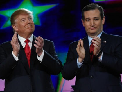 Republican presidential candidates Donald Trump (L) and Sen. Ted Cruz (R-TX) applaud as they are introduced during the CNN presidential debate at The Venetian Las Vegas on December 15, 2015 in Las Vegas, Nevada. Thirteen Republican presidential candidates are participating in the fifth set of Republican presidential debates. (Photo by …