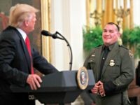 Trump Immigration President Donald Trump, left, greets Customs and Border Patrol agent Adrian Anzaldua, during an event to salute U.S. Immigration and Customs Enforcement (ICE) officers and U.S. Customs and Border Protection (CBP) agents in the East Room of the White House in Washington, Monday, Aug. 20, 2018.