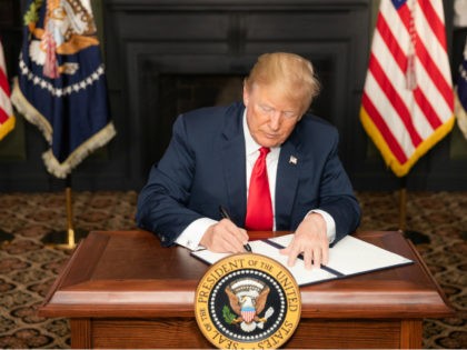 President Donald J. Trump signs an Executive Order in Bedminster, New Jersey, entitled “