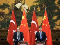 Turkey-Recep-Tayyip-Erdogan-China-Xi-Jinping-5-17-getty Turkish President Recep Tayyip Erdogan (L) and Chinese President Xi Jinping attend a signing ceremony ahead of the Belt and Road Forum in Beijing on May 13, 2017. / AFP PHOTO / AFP PHOTO AND POOL / JASON LEE (Photo credit should read JASON LEE/AFP/Getty Images)