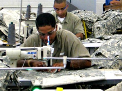 Inmates work on garments at a Federal Prison Industries (UNICOR) facility. The company says it is a ???a life-changing correctional program that has a profound impact on everyone in the community.