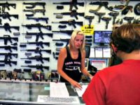 a-gun-store-employee-helps-a-customer-in-colorado a-gun-store-employee-helps-a-customer-in-colorado