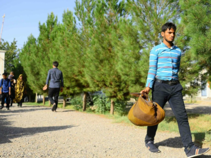 An Afghan man returns to the Afghan province of Herat from Iran, part of an exodus of migr