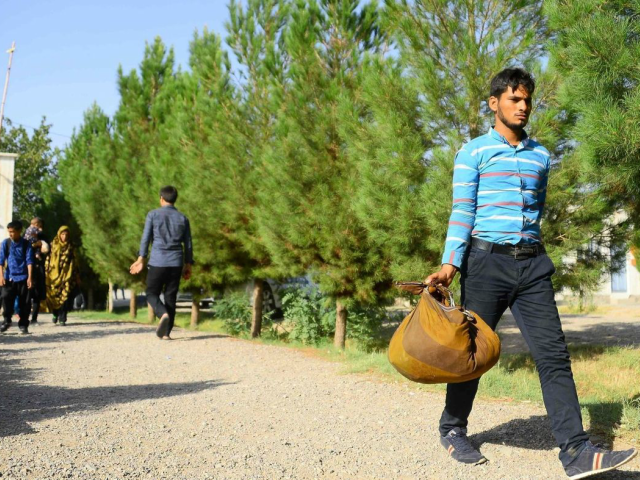 An Afghan man returns to the Afghan province of Herat from Iran, part of an exodus of migrant workers fleeing Iran's economic turmoil. (Hoshang Hashimi / AFP/Getty Images)