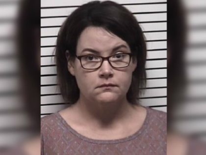A middle school teacher in North Carolina has been arrested and charged with having an improper sexual relationship with her own 15-year-old foster son, a report says.