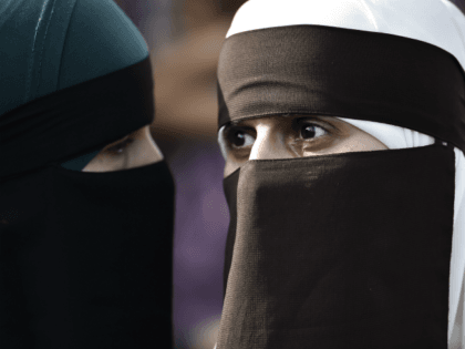 Women wearing niqab to veil their faces take part in a demonstration on August 1, 2018, the first day of the implementation of the Danish face veil ban, in Copenhagen, Denmark. - Denmark's controversial ban on the Islamic full-face veil in public spaces came into force as women protested the …