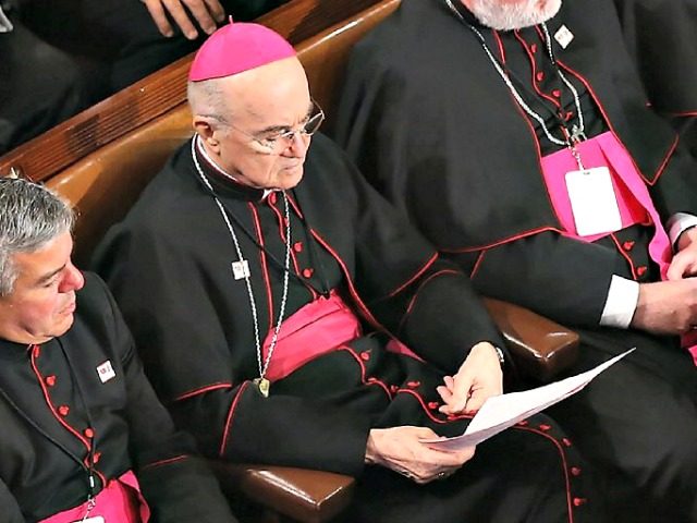 In this file photo taken on September 24, 2015 papal nuncio in Washington Archbishop Carlo Maria Vigano (C) sits among Catholic clergy and members of Congress as Pope Francis addresses a joint meeting of the US Congress in the House Chamber of the US Capitol in Washington, DC. A former …