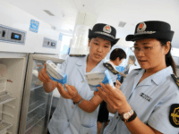Food and Drug Administration officials check vaccines for rabies at the Disease Control and Prevention Center in Huaibei in China's eastern Anhui province after public outrage over a safety scandal involving the vaccines China's persistent food and drug safety problem