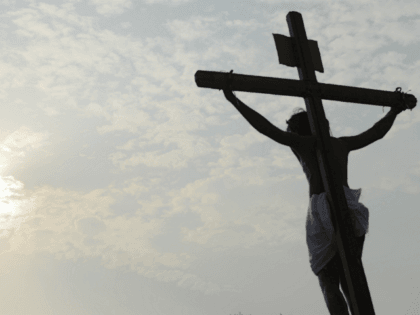 Indian Catholic devotees re-enact the crucifixion of Jesus Christ during a Passion play at The Saint Joseph's church in Hyderabad on March 30, 2018. Passion plays are a dramatic presentation depicting the suffering and death of Jesus Christ and are an integral part of Good Friday celebrations for Catholics. / …