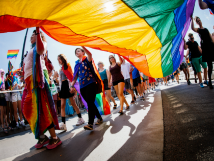 Participants carry a rainbow flag during the Gay Pride Parade on August 2, 2014, in Stockholm. AFP PHOTO/JONATHAN NACKSTRAND (Photo credit should read JONATHAN NACKSTRAND/AFP/Getty Images)
