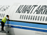 A ground crewmember takes a peek inside the cabin of a Kuwait Airways Airbus A340 at the Kuala Lumpur International Airport in Sepang, 01 November 2006. Kuwait Airways began twice-weekly flight operations from Kuwait to Kuala Lumpur with its maiden flight 01 November. AFP PHOTO/TENGKU BAHAR (Photo credit should read …