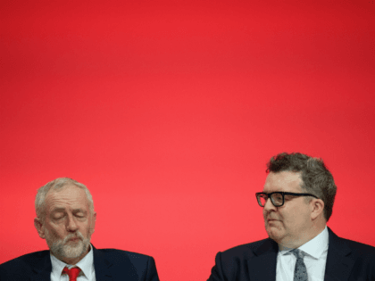 Labour Party leader Jeremy Corbyn (L) sits with Deputy leader Tom Watson on the first day of the Labour Party Conference the Exhibition Centre Liverpool on September 25, 2016 in Liverpool, England. Party leader Jeremy Corbyn will hope to re-unite the party after being re-elected leader yesterday. (Photo by Leon …