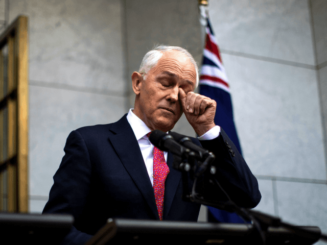 Australia's Prime Minister Malcolm Turnbull gestures as he takes part in a press conference in Canberra on August 21, 2018. - Embattled Australian Prime Minister Malcolm Turnbull narrowly survived a leadership challenge from within his own party on August 21 as discontent with his rule boiled over less than a â¦